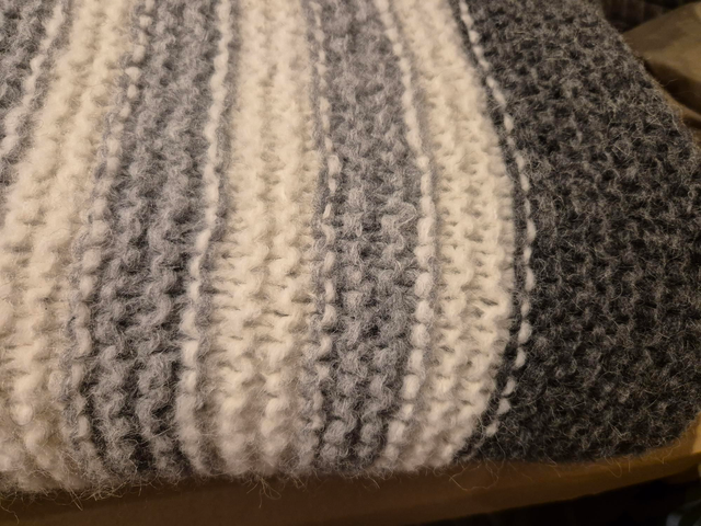 Blanket - chunky knit grey and white striped.