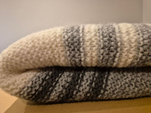 Blanket - chunky knit grey and white striped.