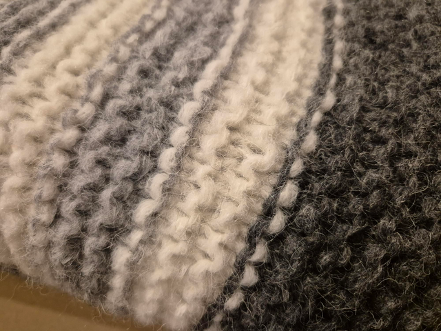 Blanket - chunky knit grey and white striped.
