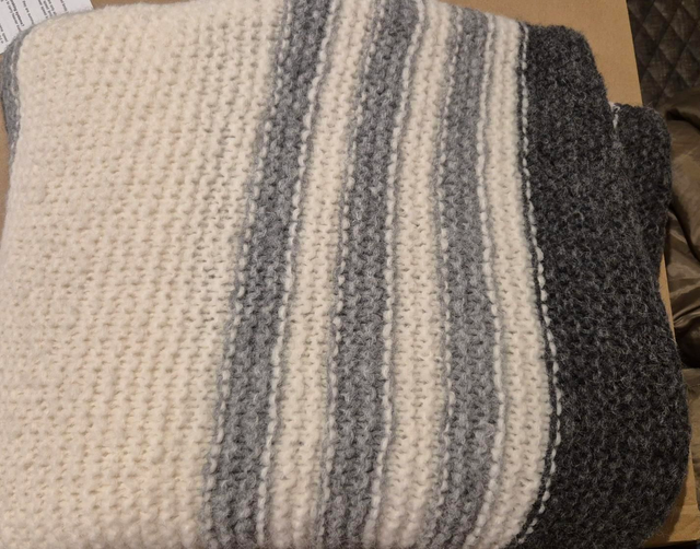Blanket - chunky knit grey and white striped.